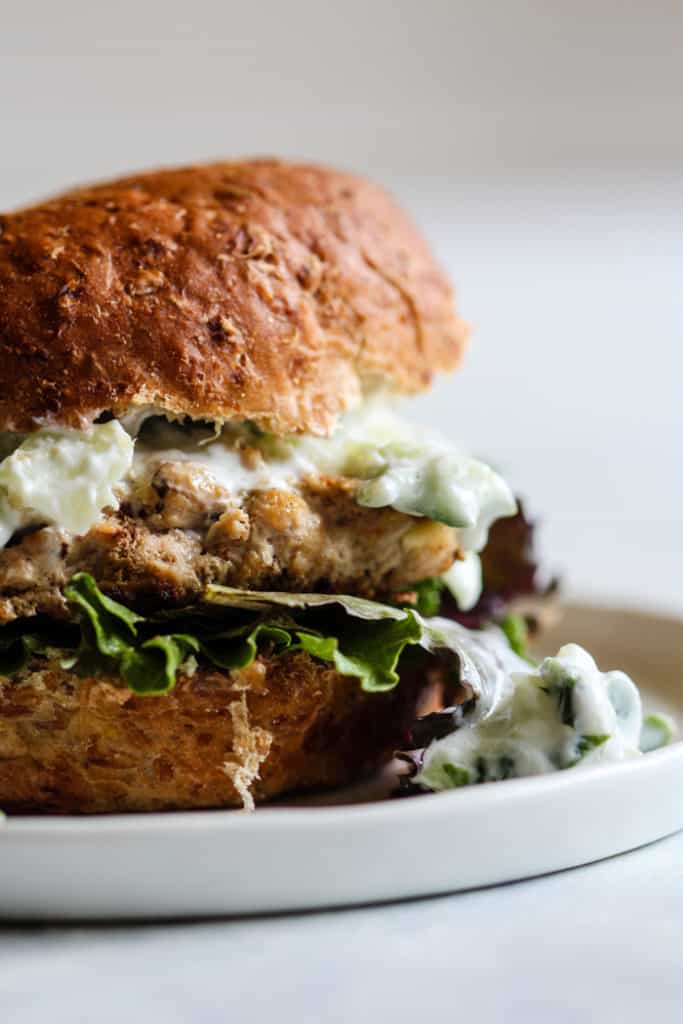 Smoky turkey burger with tzatziki on sprouted grains bun with lettuce