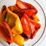 Roasted bell peppers in glass bowl