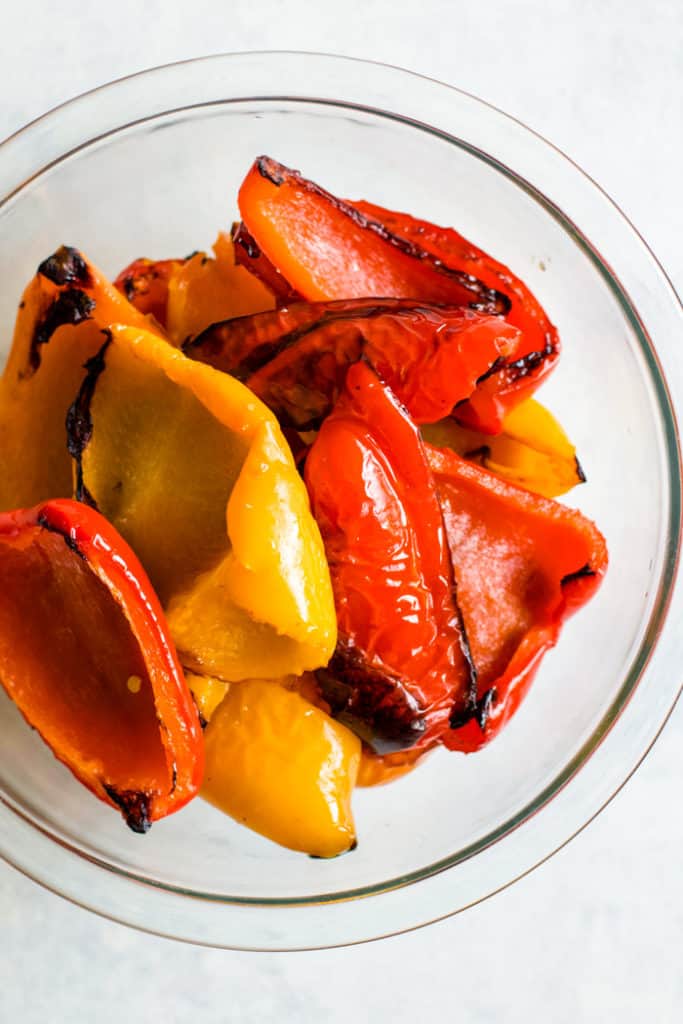 Roasted bell peppers in glass bowl