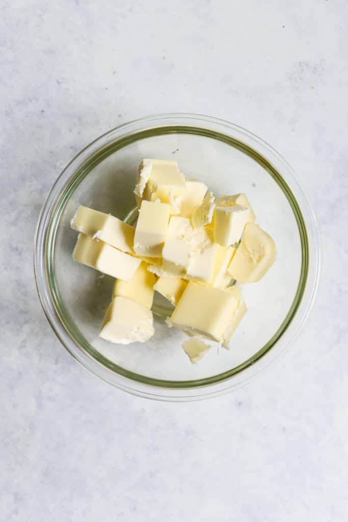 Cold butter cubes in clear glass bowl